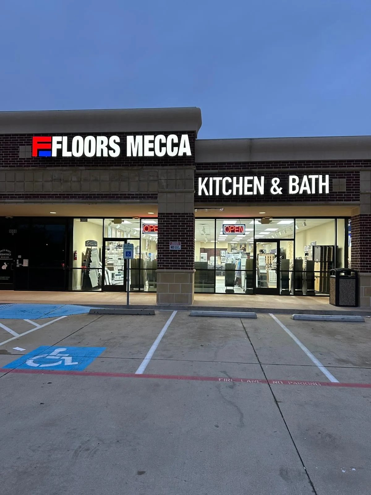 Dimensional letter storefront signs for Floors Mecca Kitchen and Bath retail showroom in Houston, Texas