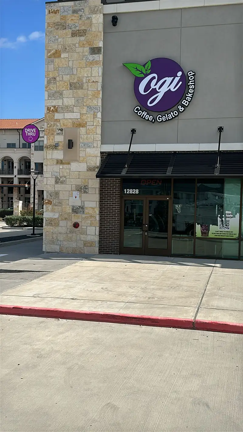 Dimensional logo sign for Ogi Coffee, Gelato, and Bakeshop on a stone commercial building in Katy, Texas