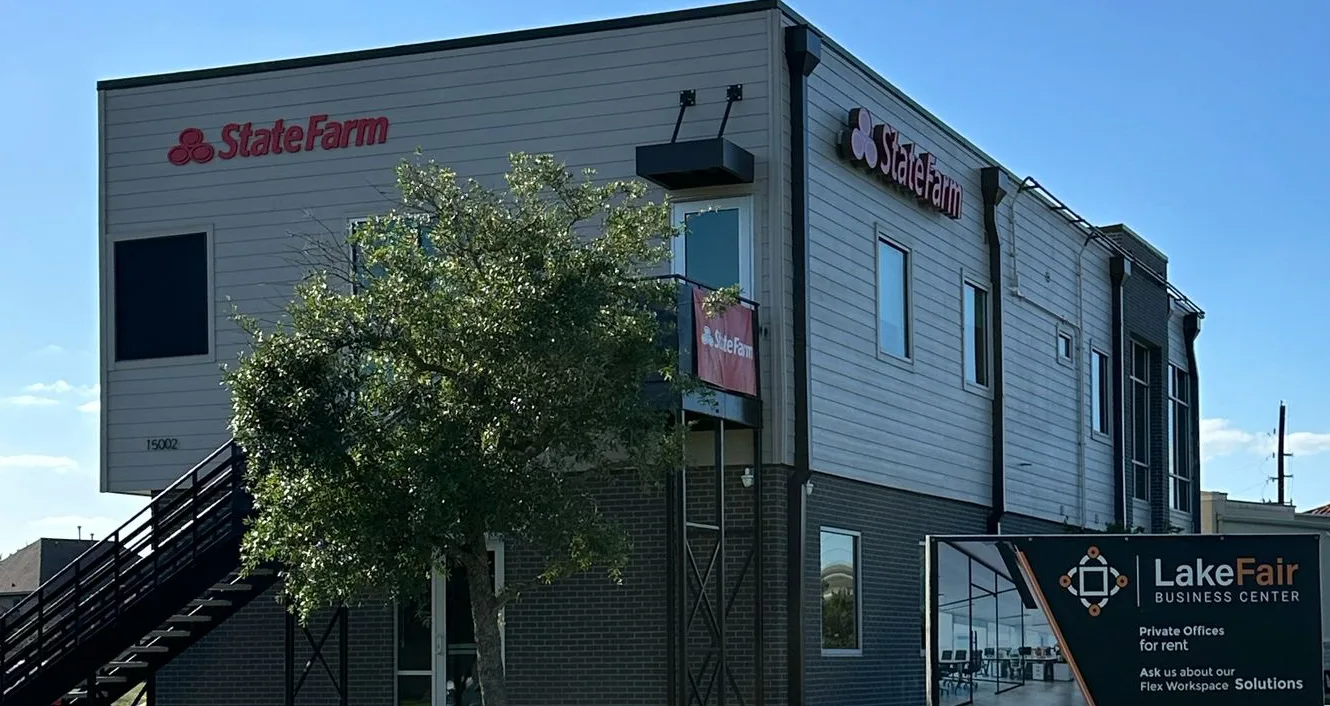 Building identification signs for State Farm and LakeFair Business Center on a two-story commercial building in Houston, Texas