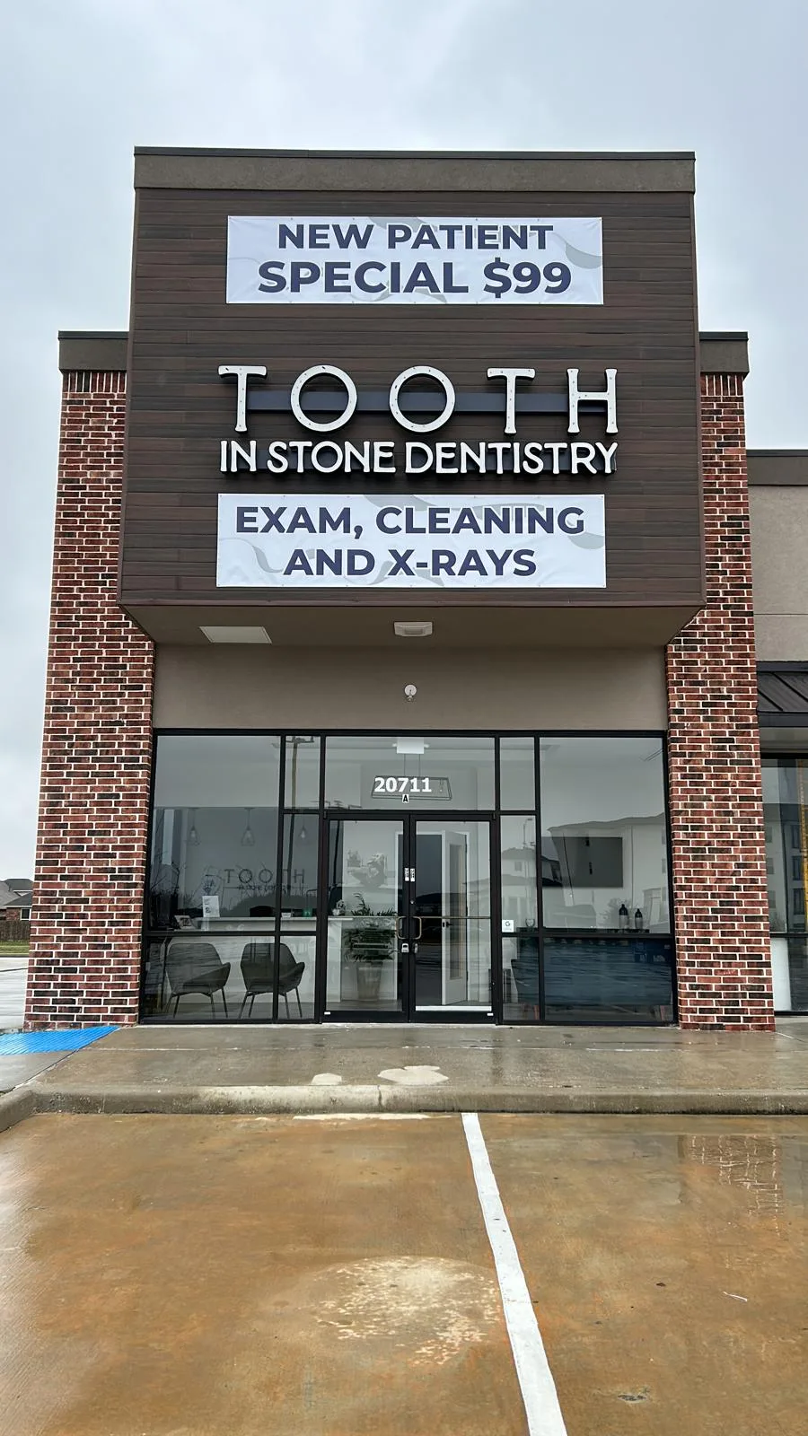 Illuminated cabinet storefront sign for Tooth in Stone Dentistry on a retail dental office in Houston, Texas